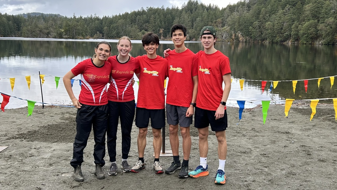 Club Rapide relay team posing together at Thetis Lake